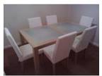 Contemporary dining table and chairs. A modern maple....